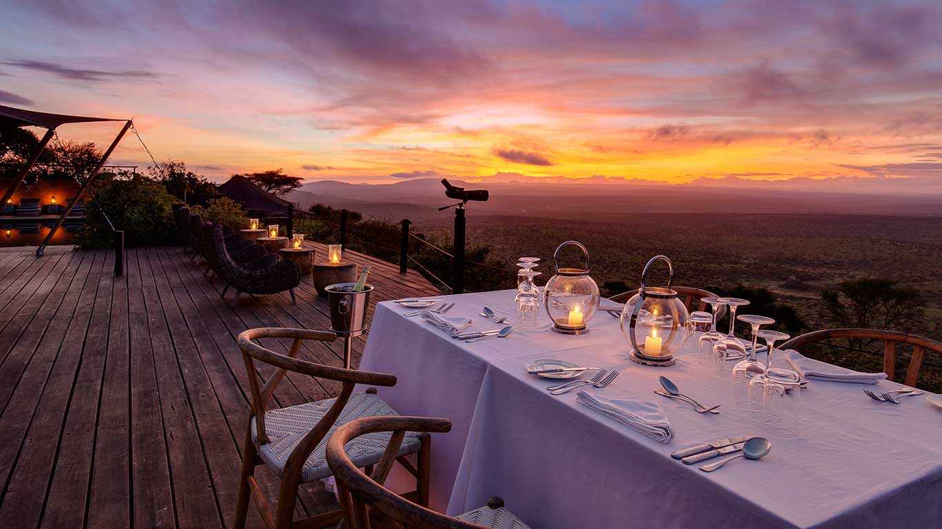 Elewana Loisaba Tented Camp accommodation romantic dinner by main areas deck